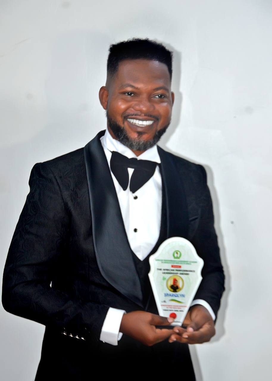 Sparqlyn smiling with trophies